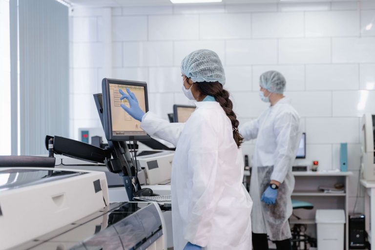 Researchers analyzing samples in a modern laboratory representing the ENFiber Infrastructure and Expertise Database