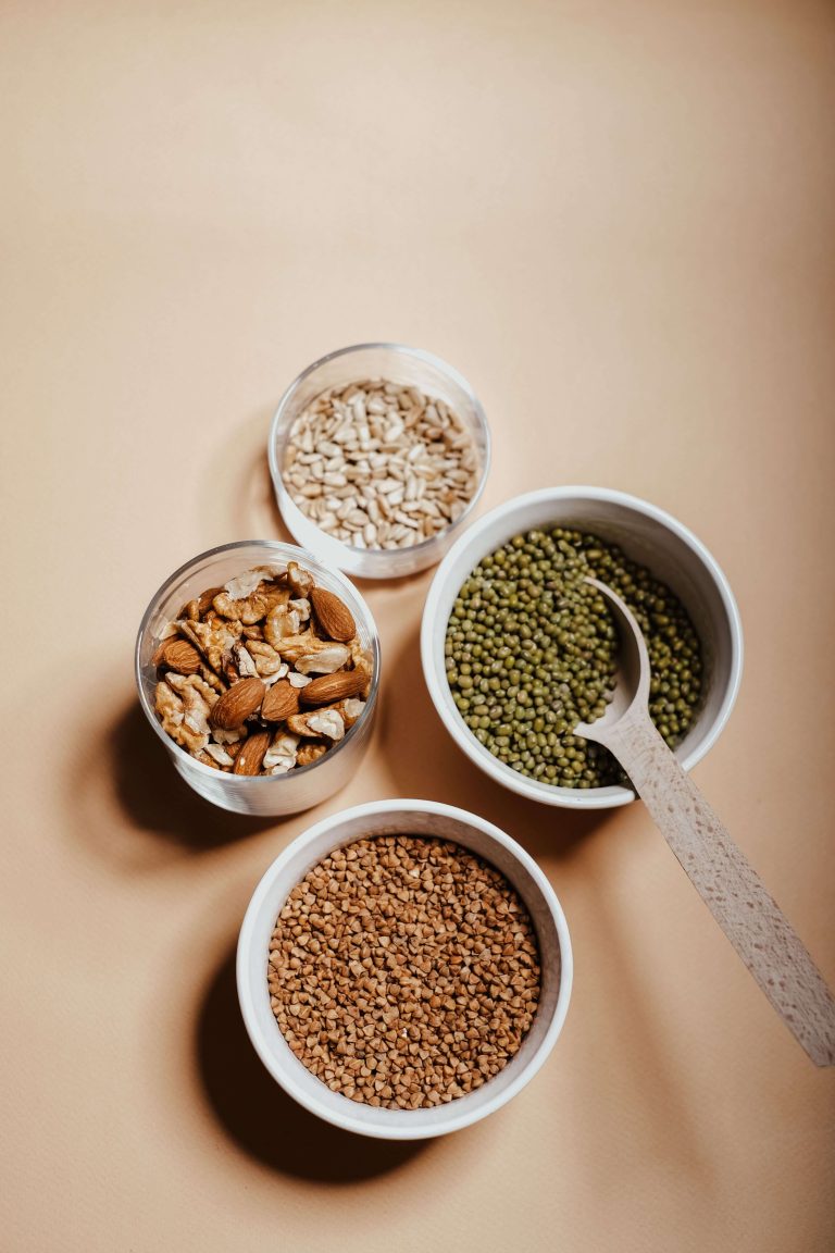 Assorted plant seeds, grains, fruits, and vegetables representing the ENFiber Database of Fiber Sources